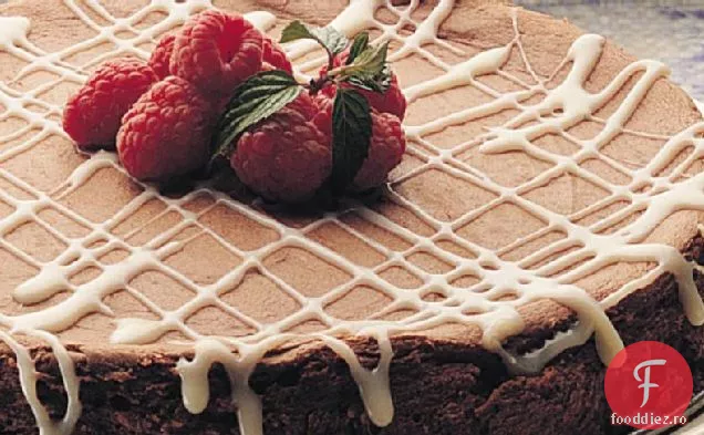 Cheesecake de ciocolată dulce-amăruie cu sos de trufe albe