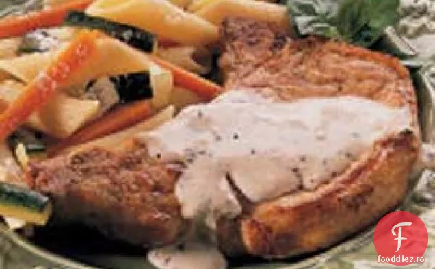 Cotlete de porc cu sos de cremă Herbed
