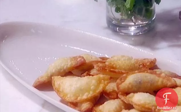 Ravioli de ricotta și vanilie cu sos de portocale și mentă
