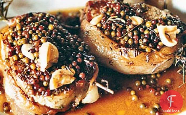 Cotlet de porc prăjit cu sos de boabe de piper verde