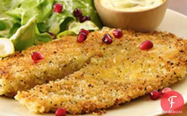 Tilapia cu ardei iute de lămâie cu salată cremoasă de vinaigretă din semințe de dovleac acoperită cu semințe de rodie