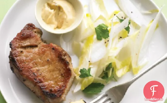 Cotlet de porc cu salată de andive și muștar de chimen